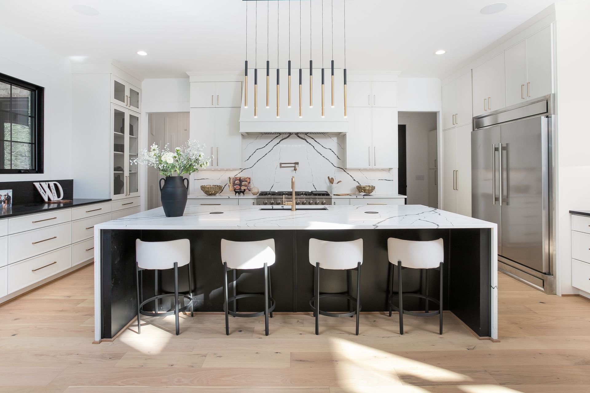 Spacious kitchen island with seating and custom cabinetry in the Strickland Heights project Summerfield NC