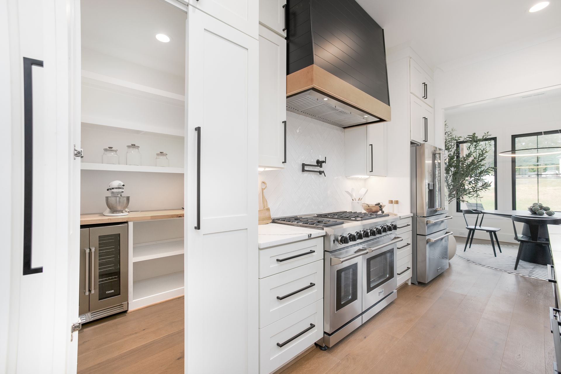 Sleek kitchen design with custom cabinetry and premium appliances in The Hills Custom Cabinetry Project Summerfield NC