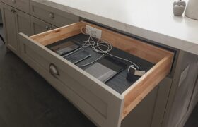 Legacy by Körner Drawer Charging & Power Station with built-in outlets and USB ports, shown open to store and charge devices neatly inside a kitchen drawer.