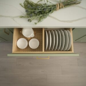 Plate rack & dish storage combo in a modern kitchen drawer with neatly organized dishes and bowls.