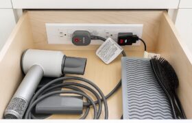 Vanity Grooming Drawer with Charging Dock in Körner Legacy Storage Solutions, featuring hair dryer and styling tool organization.