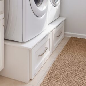 Laundry storage drawers under washer and dryer units from the Legacy Utility collection.