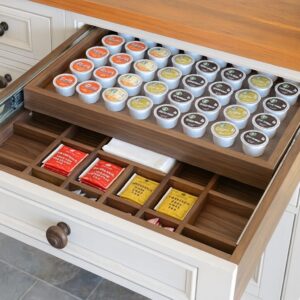 Two tier coffee pod drawer from Legacy kitchen storage with neatly arranged coffee capsules in a modern cabinet.