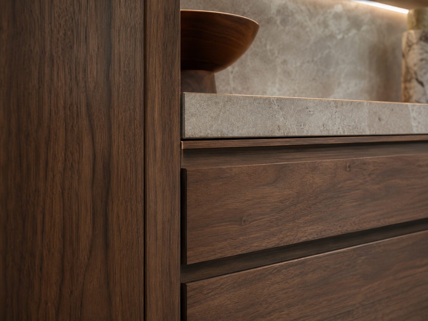 Natural wood cabinetry and stone surfaces in a restrained luxury kitchen