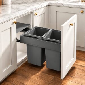 Pull out trash cabinet with two concealed waste bins integrated into a white base cabinet.