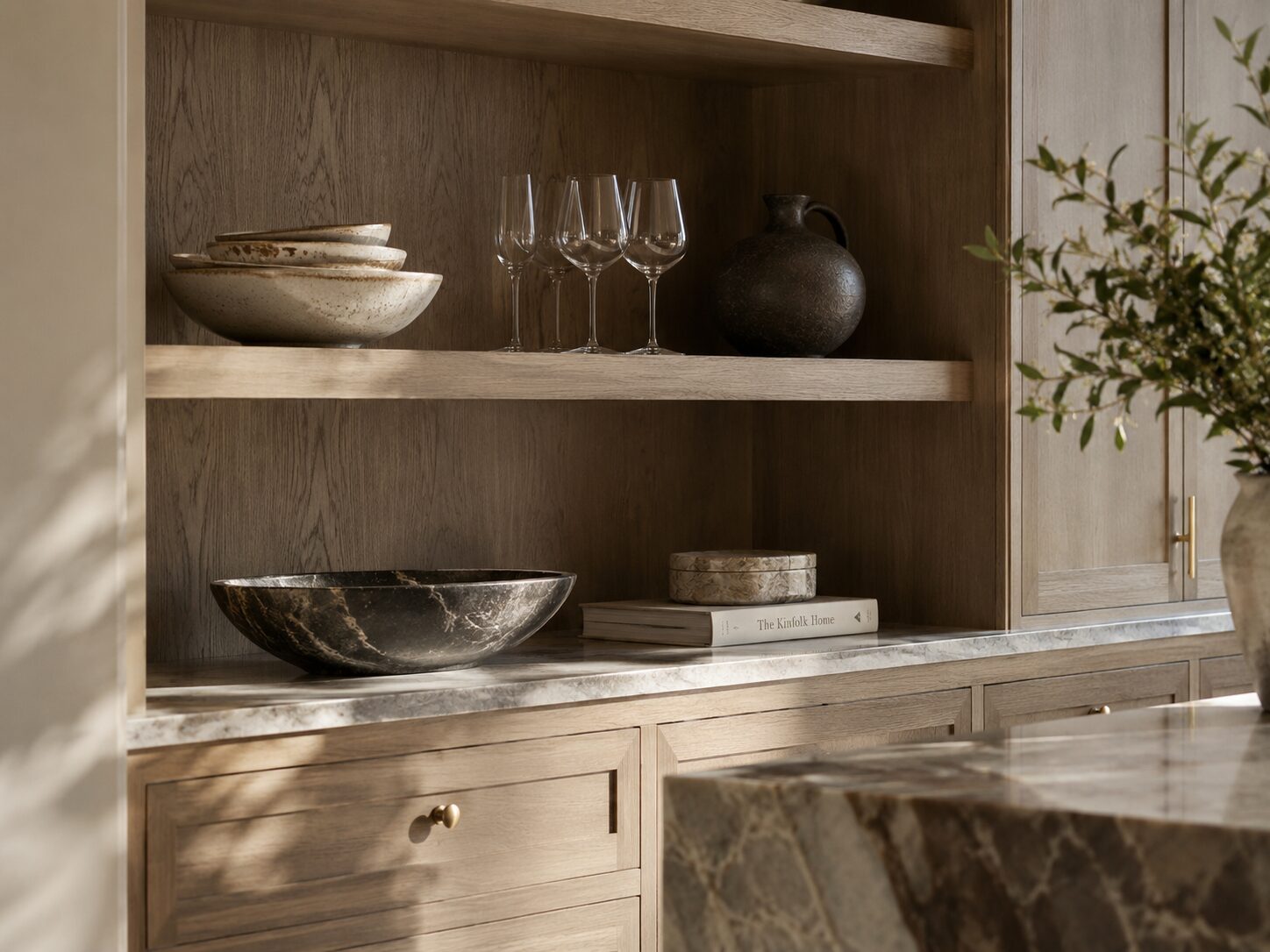 Curated objects intentionally displayed within a luxury kitchen