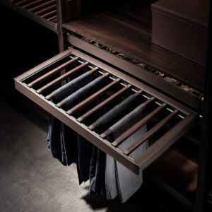 Pull-out trouser rack for organized pants storage in a luxury custom closet